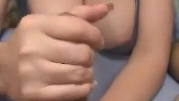 Busty chick gives a handjob point of view