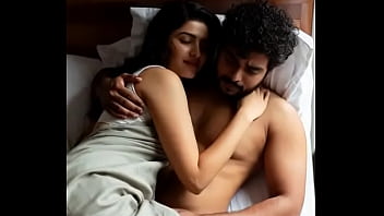 Erotic kissing scene of woman and man on bed in saree