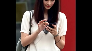 Attractive chinese looking woman got upskirt by the wind