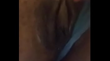 Petite ebony plays with her wet pussy