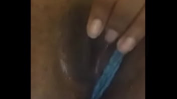 Petite ebony plays with her wet pussy