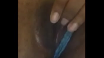 Petite ebony plays with her wet pussy