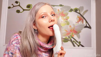A nymph in a sweater expands her holes by inserting a vibrator blowjob and female orgasm