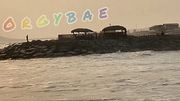 Couple play voyeur at public bar and beach