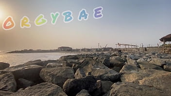 Couple play voyeur at public bar and beach