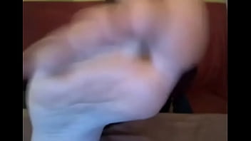 Webcam model in sweatshirt suck her own toes