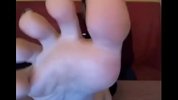 Webcam model in sweatshirt suck her own toes
