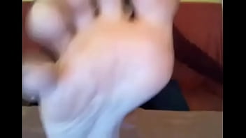 Webcam model in sweatshirt suck her own toes