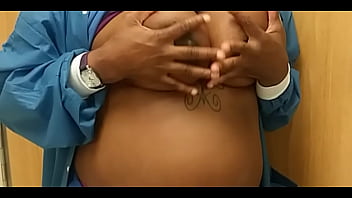 While doing her 9 to 5 she decided to rub her breasts in the closest