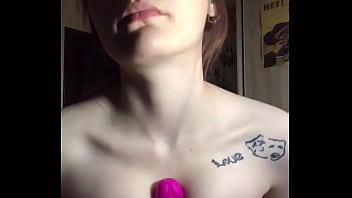 Rubs her tits on a rubber dick