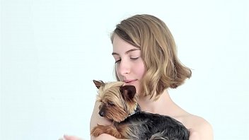 Hot naked blonde cuddling her puppy