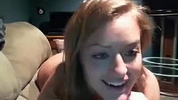 Busty blonde playing with a black dildo