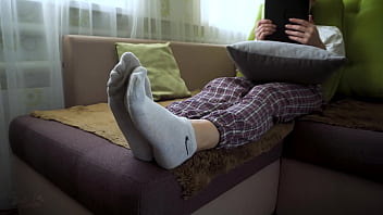 Asian girl in white socks teasing her bare soles Asian girl in white socks teasing her bare soles