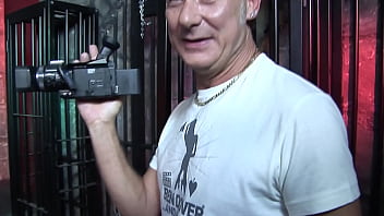 The red lights glow as this skinny blonde chick gets her hole fucked by a dude wearing a