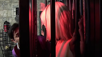 The red lights glow as this skinny blonde chick gets her hole fucked by a dude wearing a