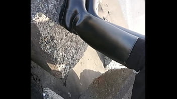 Fetish rubber boots at beach