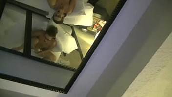 Swinger resort masturbating with the hotel window open to the public