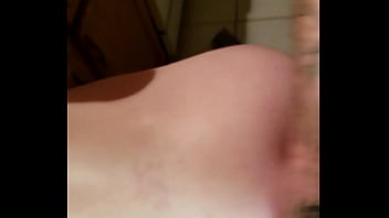 Bent over the kitchen counter