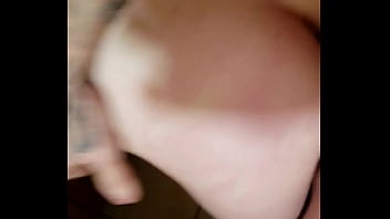 Bent over the kitchen counter