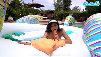 Sexy babe plays with her pussy in the pool