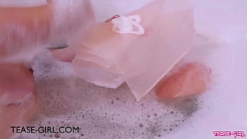 Pretty brunette caress her body in the bath