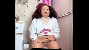 Chubby girl can't stop farting in toilet with belly ache