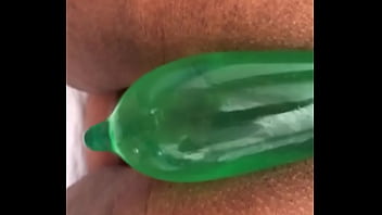 Removing a rubber filled with piss from ebony’s pussy Removing a rubber filled with piss from ebony’s pussy