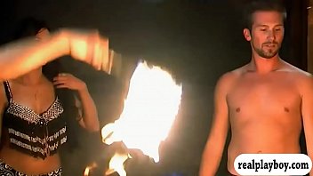 Sexy babes fire dancing and give massage