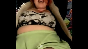 Mature busty with tattoos on her tits dances weird