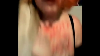 Mature busty with tattoos on her tits dances weird