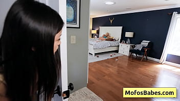 See this petite oriental black haired teenager seducing her big tit blondie friend