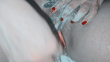 Milf shaving her pussy up close and lots of soap