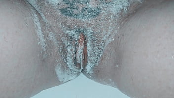 Milf shaving her pussy up close and lots of soap