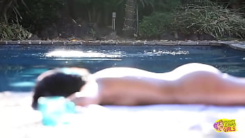 The individual with attractive dark hair has a fondness for engaging in oral stimulation of the female genitalia with her female partner subsequent to the latter's departure from the swimming pool The individual with attractive dark hair has a fondness for engaging in oral stimulation of the female genitalia with her female partner subsequent to the latter's departure from the swimming pool