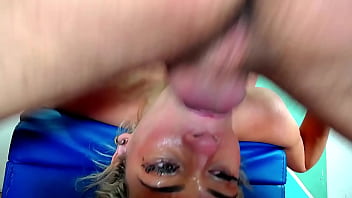 Blonde gets an exaggerated throat fuck on upsidedow