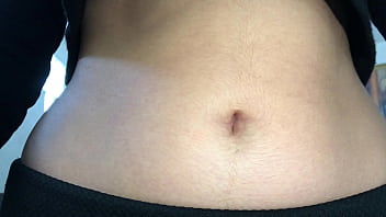 Oval shaped navel close up and looking inside her navel