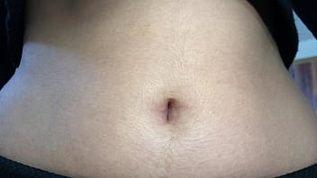 Oval shaped navel close up and looking inside her navel