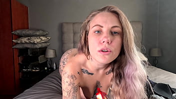 Tattooed blonde taking off her clothes smokes her vape naked