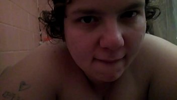 Step sister gives her a blowjob in the bath while husband is at work