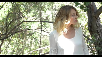 Stunning blonde beauty gets naked between the trees