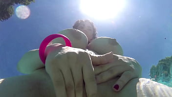 Natural tits superstar teases with cleavage in pool