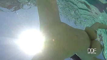 Natural tits superstar teases with cleavage in pool