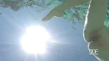 Natural tits superstar teases with cleavage in pool