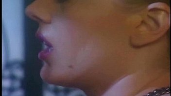 Masturbating blonde in a latex skirt nylons and boots