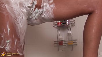 Sexy big natural milf takes a hot shower and shavinger her soapy pussy