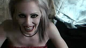 Horny babe with brace fingering her pussy