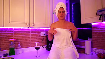 This girl masturbates in kitchen