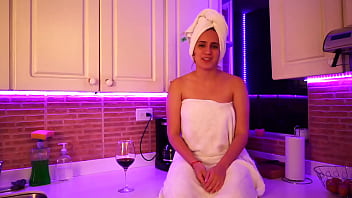 This girl masturbates in kitchen