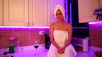 This girl masturbates in kitchen