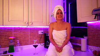 This girl masturbates in kitchen